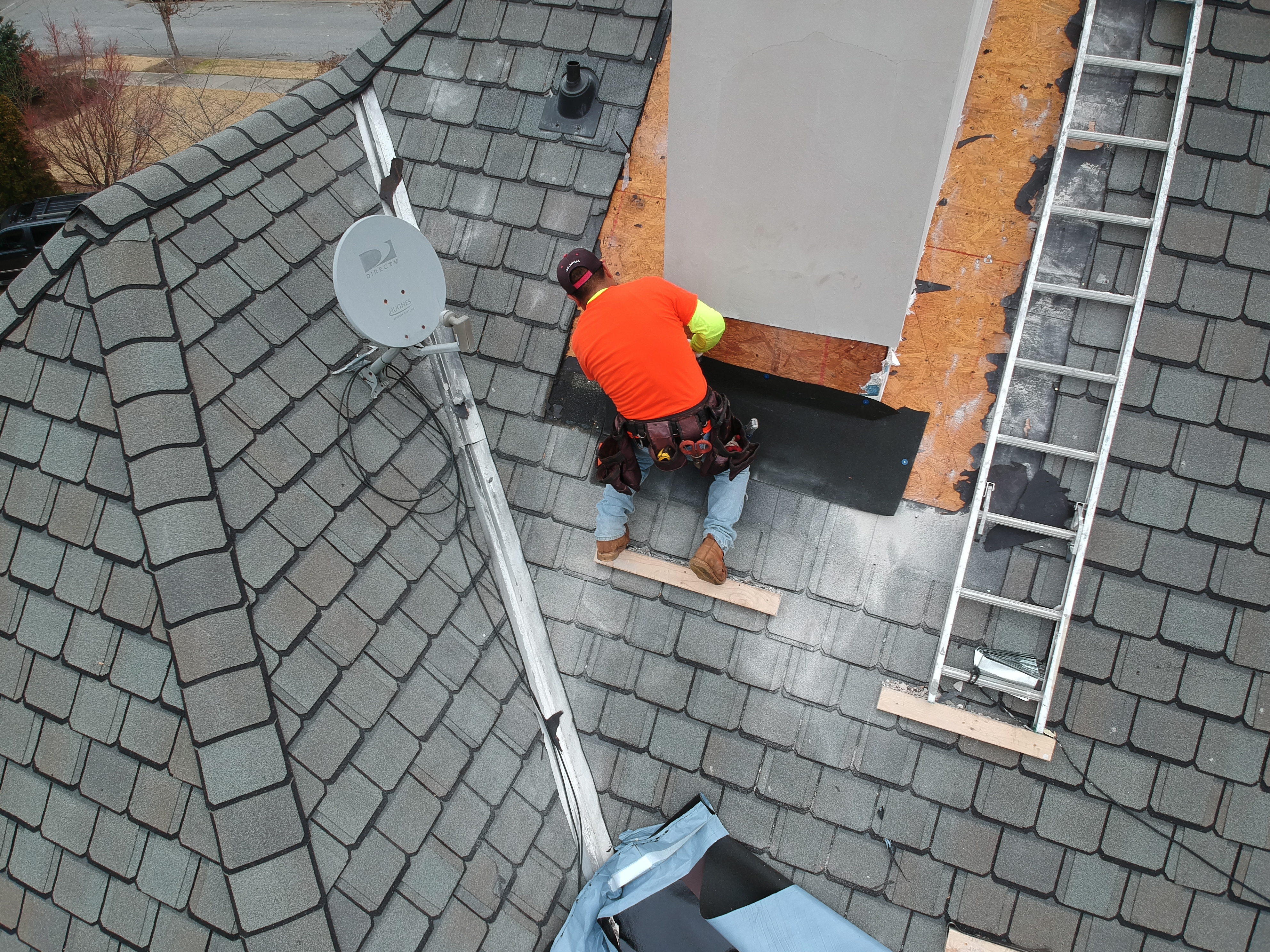 Chimney flashing detail with counter flashing and step flashing on an Atlanta residential roof